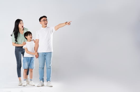 a family posing on a white background photo