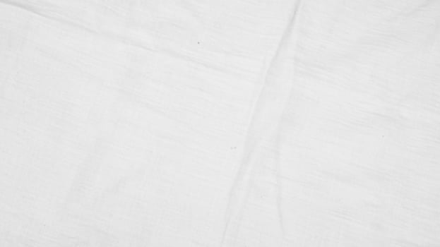 Organic Fabric cotton backdrop White linen canvas crumpled natural cotton fabric Natural handmade linen top view background  organic Eco textiles White Fabric linen texture photo