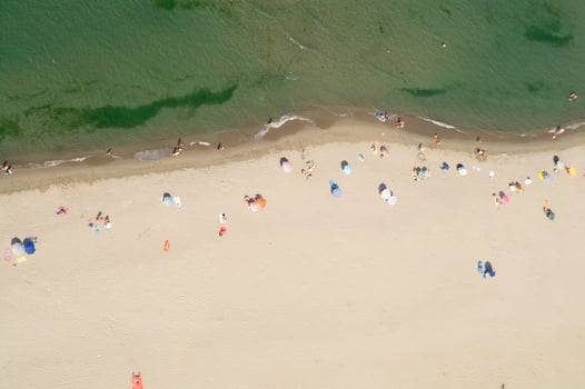 a beach with many people on it photo