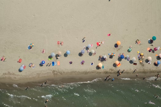 a beach with many people on it photo
