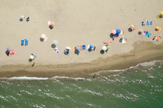 a beach with many people on it photo