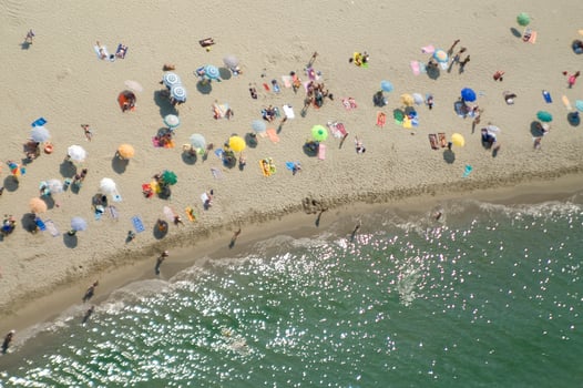 a beach with many people on it photo