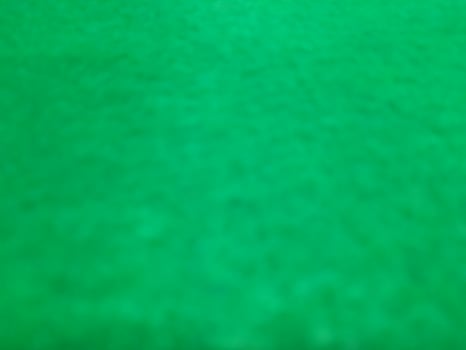 Defocused abstract carpet background in bright green color photo