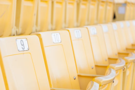 Empty yellow seats at stadium,Rows of seat on a soccer stadium,select focus photo