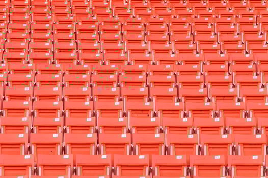Empty orange seats at stadium,Rows of seat on a soccer stadium photo