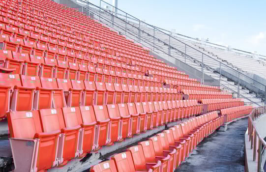 Empty orange seats at stadium,Rows of seat on a soccer stadium photo