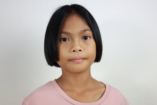 Portrait of child on the grey background photo
