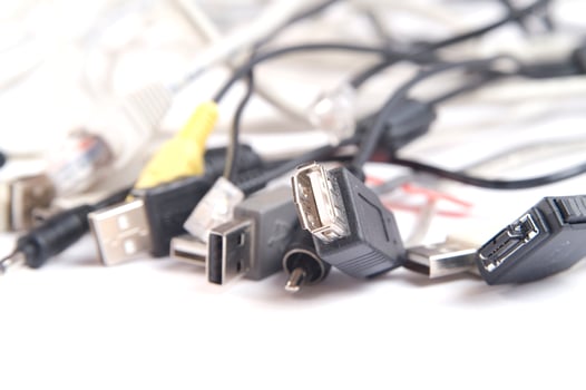 a hand holding several different types of cables photo