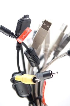 a hand holding several different types of cables photo