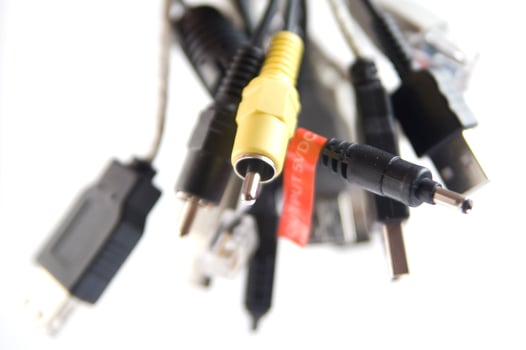a hand holding several different types of cables photo