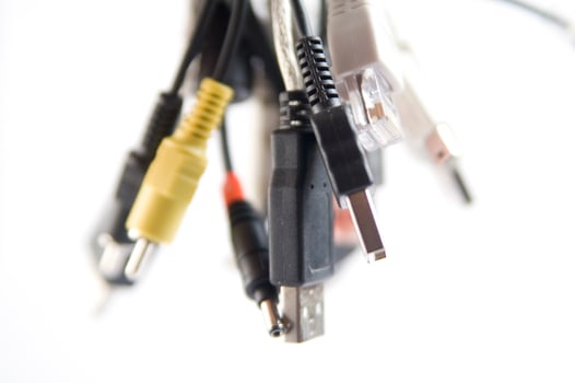 a hand holding several different types of cables photo