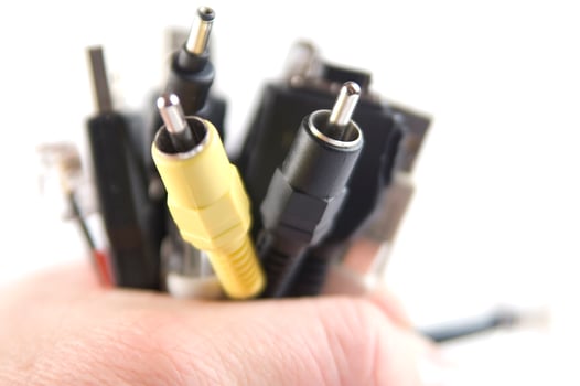 a hand holding several different types of cables photo