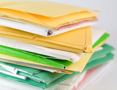 Stack of practices to be processed in the office photo