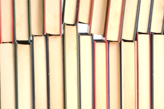 a stack of books on a white background photo