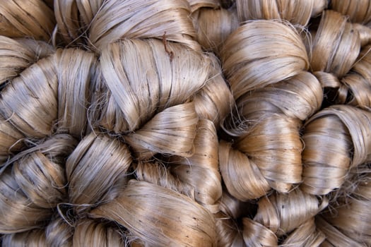 Thick Golden bundle of raw jute fiber Pattern Texture Can be used as a Background wallpaper photo
