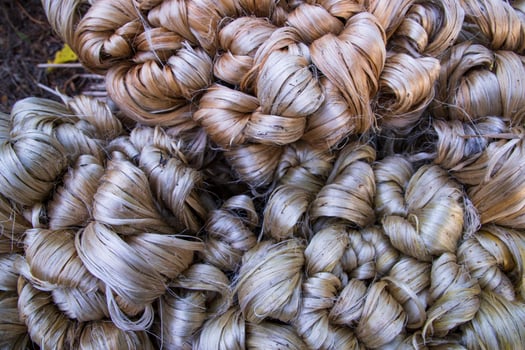 Thick Golden bundle of raw jute fiber Pattern Texture Can be used as a Background wallpaper photo