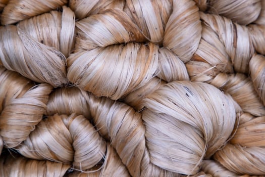 Thick Golden bundle of raw jute fiber Pattern Texture Can be used as a Background wallpaper photo