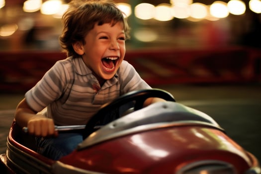 A close - up shot of a young boy, laughing and enjoying the adrenaline rush of a bumper car collision. Generative AI photo