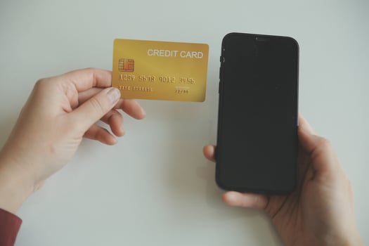Woman hands holding and using cradit card for shopping online. photo