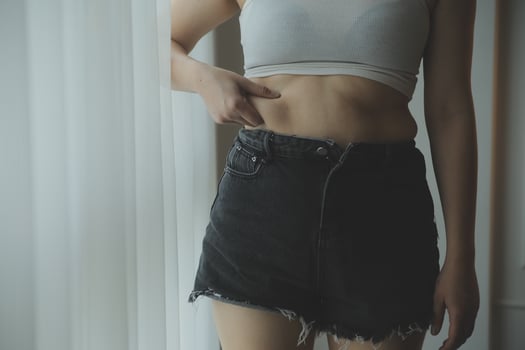 Fat woman measuring , fat woman fat belly chubby paunchy sport recreation health care lose belly fat do not exercise concept photo