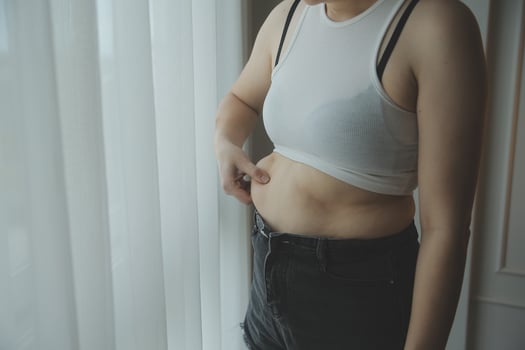 Fat woman measuring , fat woman fat belly chubby paunchy sport recreation health care lose belly fat do not exercise concept photo