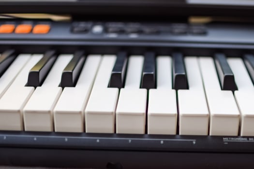 Close-up of piano keys. Piano black and white keys and Piano keyboard musical instrument placed at the home balcony during sunny day. photo
