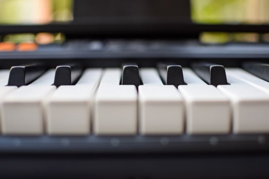 Close-up of piano keys. Piano black and white keys and Piano keyboard musical instrument placed at the home balcony during sunny day. photo