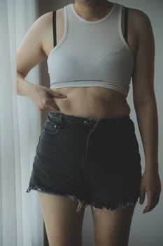 Fat woman measuring , fat woman fat belly chubby paunchy sport recreation health care lose belly fat do not exercise concept photo