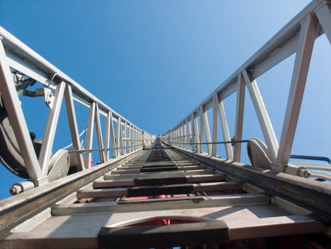 a tall metal tower with a blue sky in the background photo