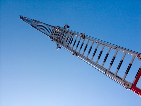 a tall metal tower with a blue sky in the background photo