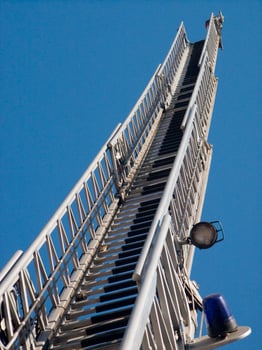 a tall metal tower with a blue sky in the background photo