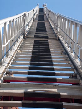 a tall metal tower with a blue sky in the background photo