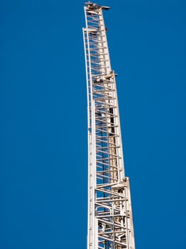a tall metal tower with a blue sky in the background photo