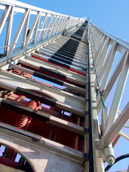 a tall metal tower with a blue sky in the background photo