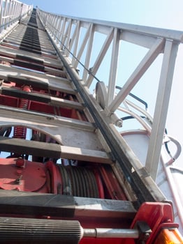 a tall metal tower with a blue sky in the background photo