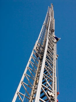 a tall metal tower with a blue sky in the background photo