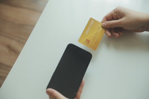 Woman hands holding and using cradit card for shopping online. photo