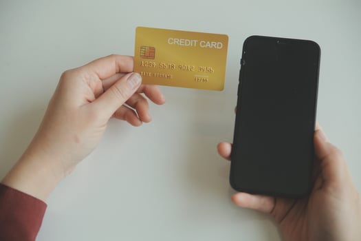 Woman hands holding and using cradit card for shopping online. photo