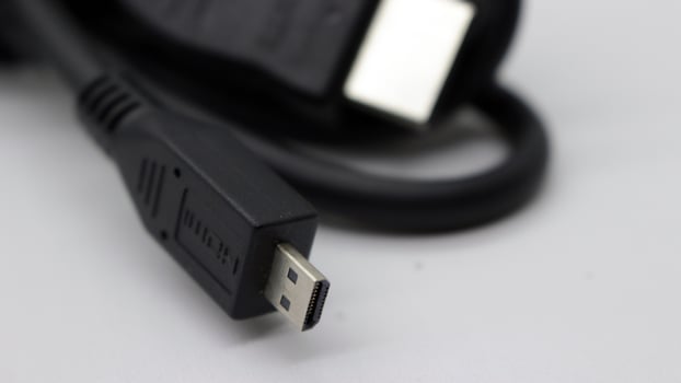 Black monitor cable that is neatly rolled photo