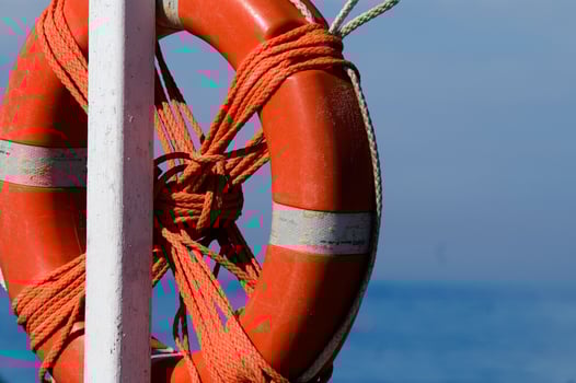 two life preservers on a beach photo