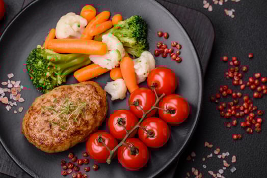 Delicious fresh fried minced fish cutlets with spices and herbs photo