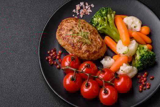 Delicious fresh fried minced fish cutlets with spices and herbs photo