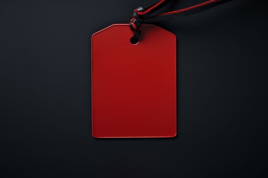 Red empty price tag on black or dark background. Black Friday concept, template copyspace photo