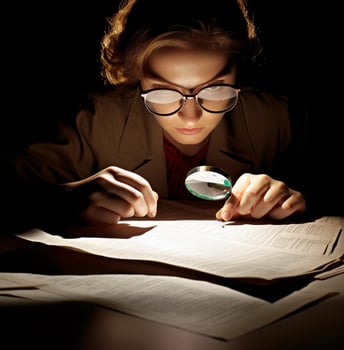 The auditor is a silhouette her face obscured by the shadows, business and marketing stock photos