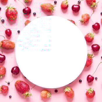 Creative layout of berries with space for text on white paper. Mockup. View from above. - Image photo
