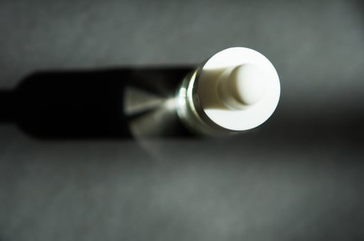 Cosmetic or medical glass bottle with pipette. Skin care concept. Natural hard light, deep shadows. - Image photo