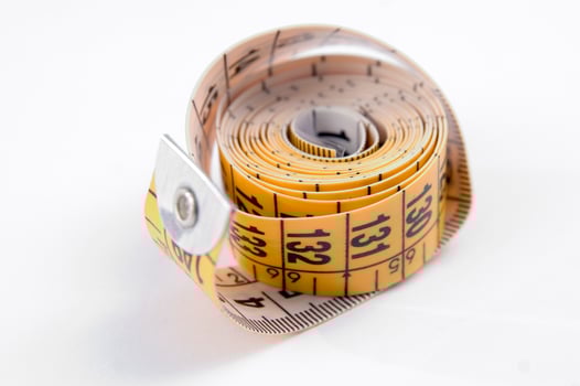 a close up of a measuring tape with numbers photo