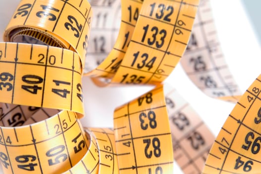 a close up of a measuring tape with numbers photo