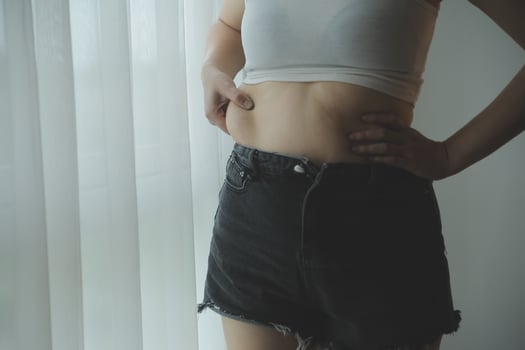 Fat woman measuring , fat woman fat belly chubby paunchy sport recreation health care lose belly fat do not exercise concept photo