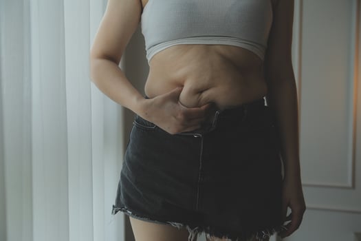 Fat woman measuring , fat woman fat belly chubby paunchy sport recreation health care lose belly fat do not exercise concept photo